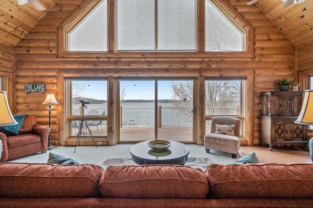 living room featuring wood ceiling, ceiling fan, log walls, high vaulted ceiling, and a water view