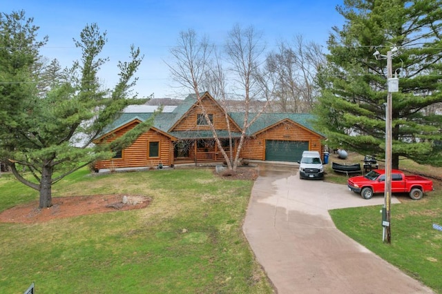 cabin featuring a front lawn and a garage