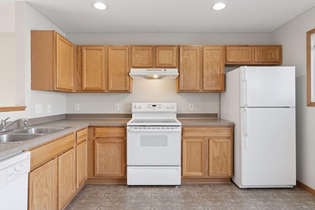 kitchen with sink and white appliances