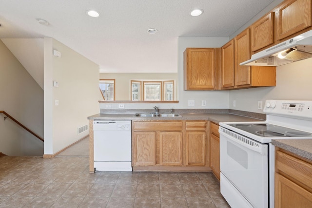 kitchen featuring sink and white appliances