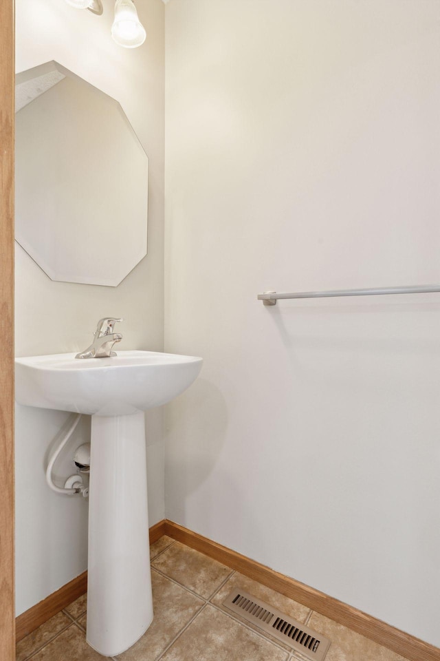 bathroom with tile patterned floors