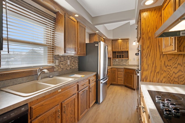 kitchen featuring extractor fan, light hardwood / wood-style floors, tasteful backsplash, black appliances, and sink