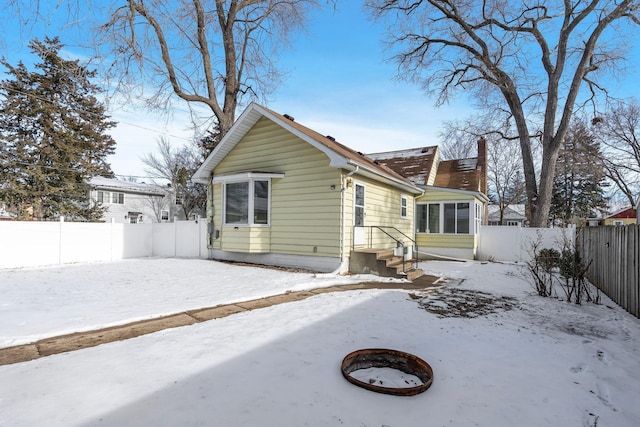 view of front of house with an outdoor fire pit