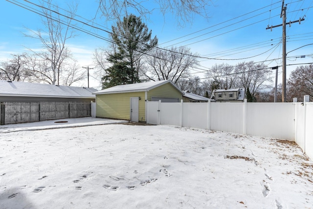 view of yard layered in snow