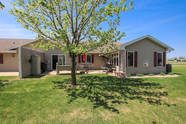 1406 Elsie Dr, Glencoe, MN 55336 - back of property with a patio and a yard
