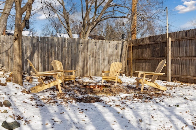 view of yard layered in snow