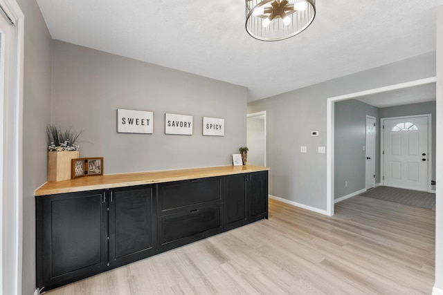 interior space featuring wooden counters and light hardwood / wood-style flooring