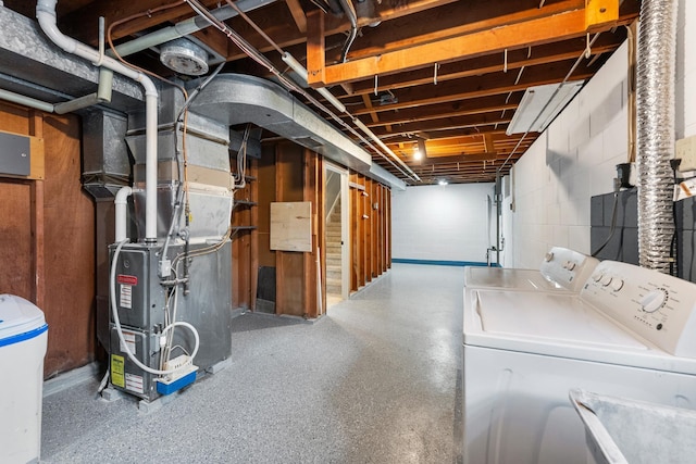 basement with separate washer and dryer and heating unit