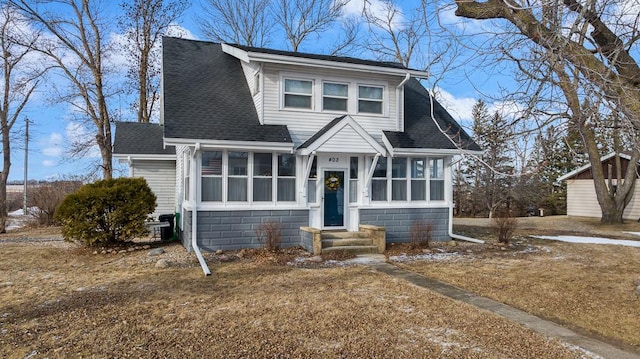 view of front of house featuring a sunroom