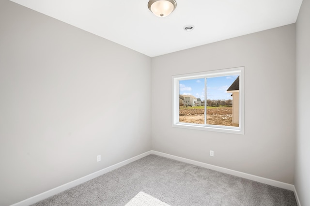 spare room featuring carpet floors