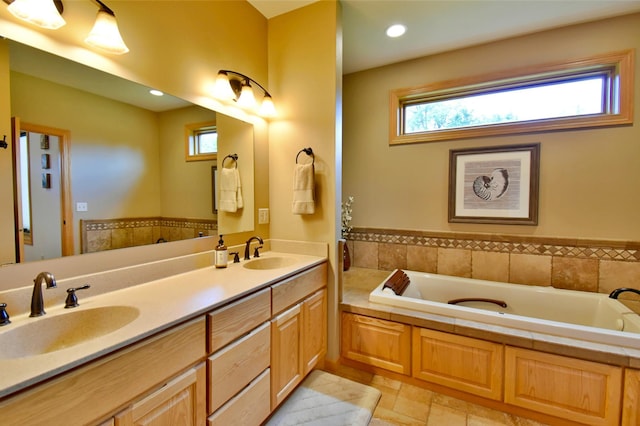 bathroom with a bathing tub and vanity