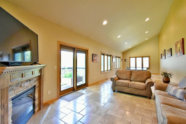 living room featuring a fireplace and high vaulted ceiling