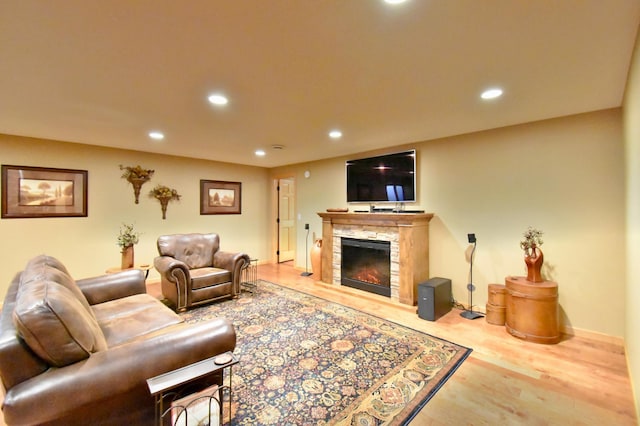 living room with hardwood / wood-style floors and a fireplace