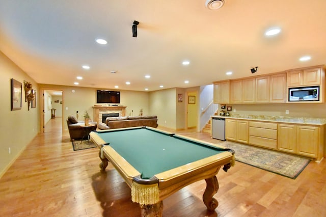 recreation room featuring pool table and light hardwood / wood-style floors