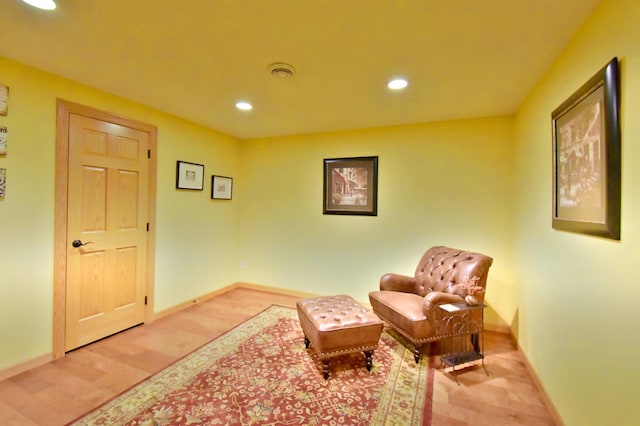 living area with light hardwood / wood-style flooring