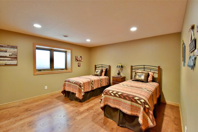 bedroom with light hardwood / wood-style flooring