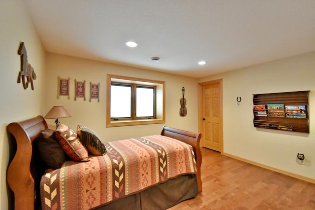 bedroom with light wood-type flooring