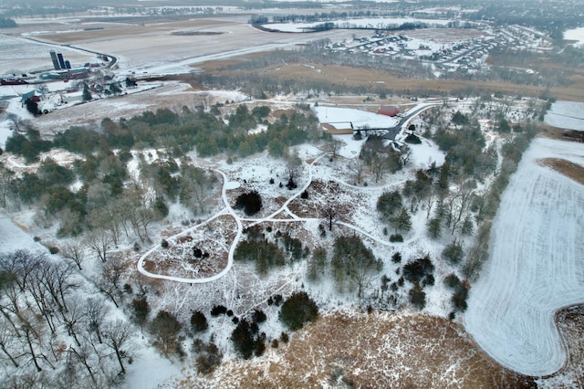 snowy aerial view featuring a rural view