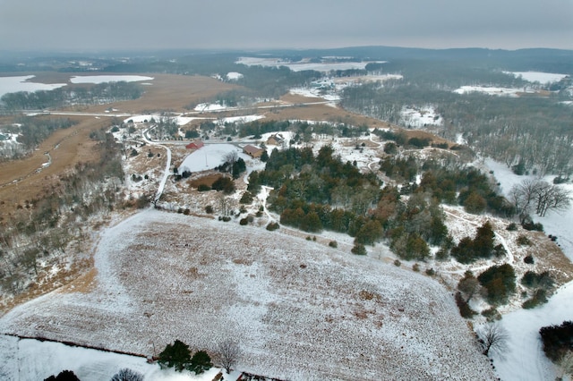 snowy aerial view featuring a mountain view