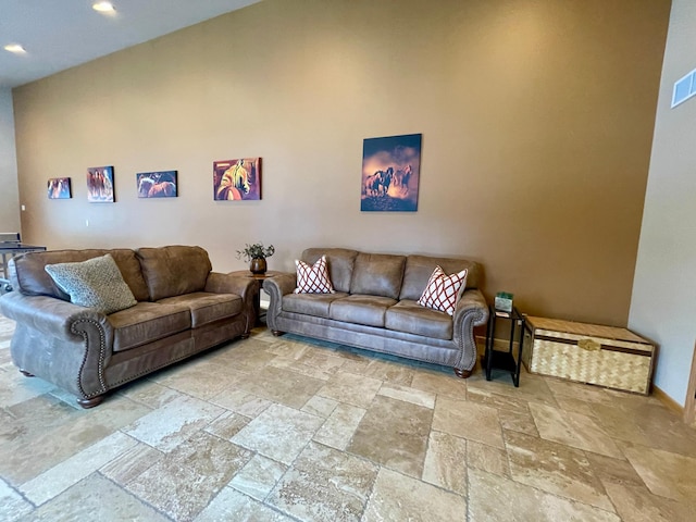 living room with a high ceiling