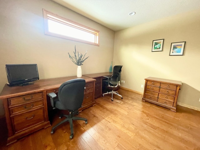 office area with light wood-type flooring