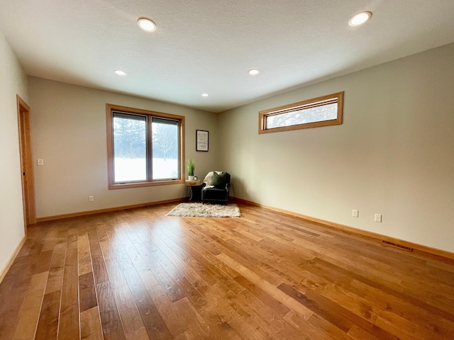 spare room with light hardwood / wood-style floors