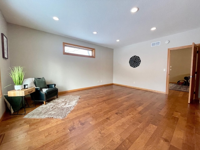 living area featuring hardwood / wood-style floors