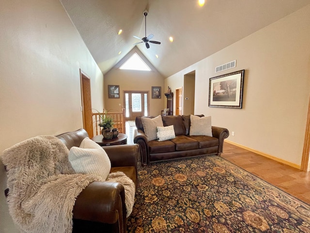 living room featuring hardwood / wood-style flooring, high vaulted ceiling, and ceiling fan