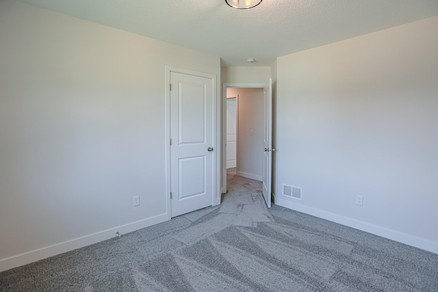 unfurnished room with light colored carpet