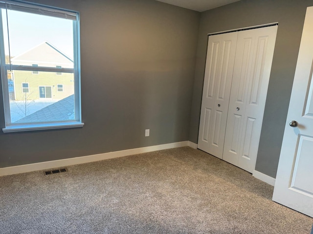 unfurnished bedroom featuring a closet