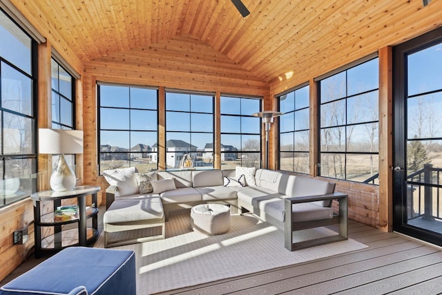 sunroom / solarium with wooden ceiling, a healthy amount of sunlight, and vaulted ceiling