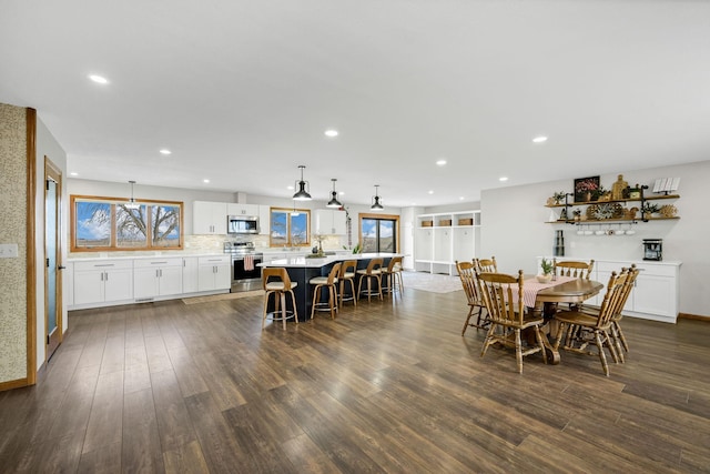 dining room with dark hardwood / wood-style floors