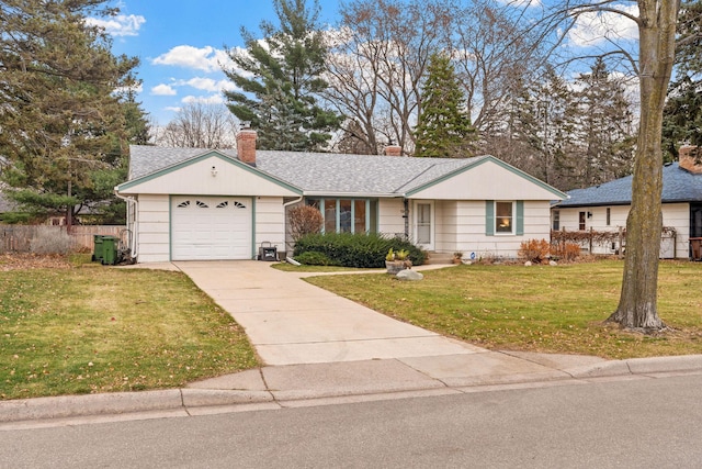 ranch-style house with a garage and a front yard