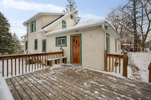 view of snow covered deck