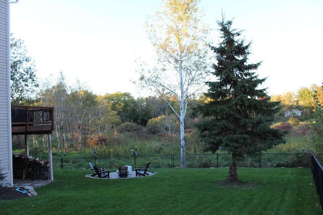 view of yard with an outdoor fire pit