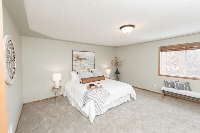 carpeted bedroom featuring a textured ceiling