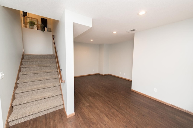 staircase featuring hardwood / wood-style flooring