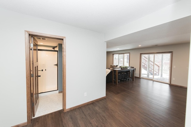 unfurnished room featuring dark wood-type flooring