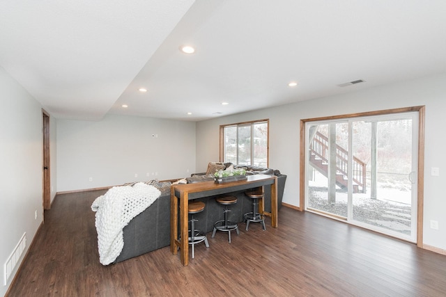 dining space featuring dark wood-type flooring