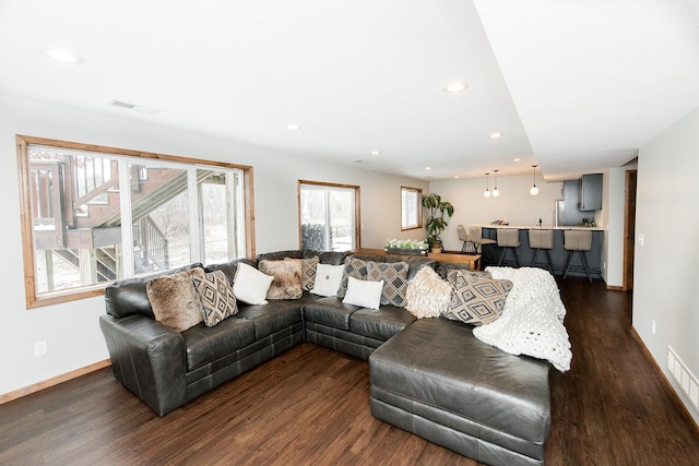 living room featuring dark hardwood / wood-style flooring