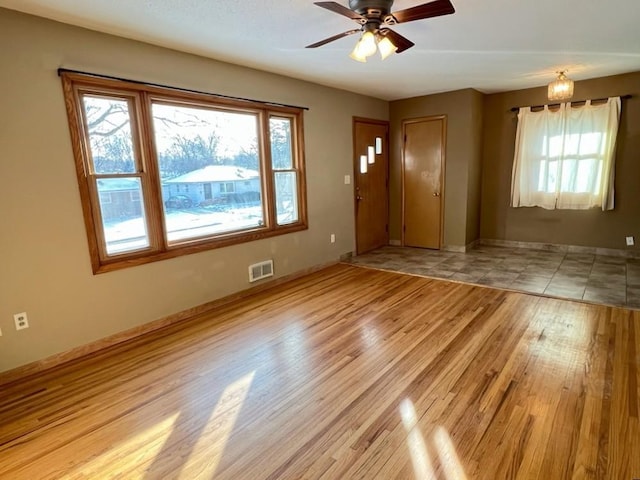 interior space with ceiling fan and light wood-type flooring