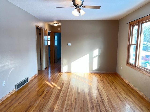 unfurnished room featuring ceiling fan and light hardwood / wood-style floors