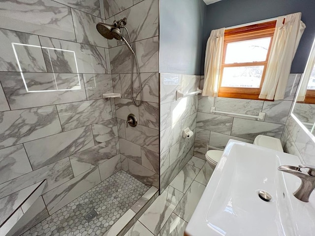 bathroom featuring tile walls, toilet, and a tile shower