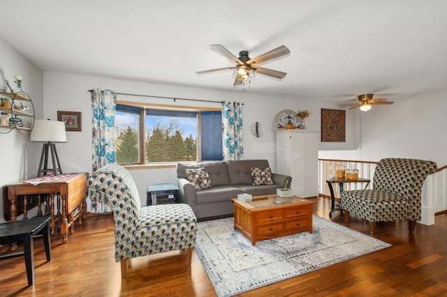 living room featuring light hardwood / wood-style floors and ceiling fan