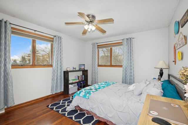 bedroom featuring dark hardwood / wood-style floors and ceiling fan