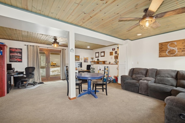 living room featuring ceiling fan, light carpet, and wooden ceiling