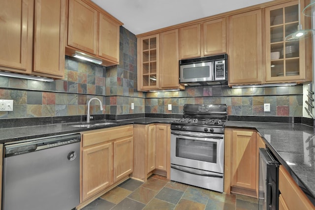 kitchen with beverage cooler, decorative backsplash, appliances with stainless steel finishes, and a sink