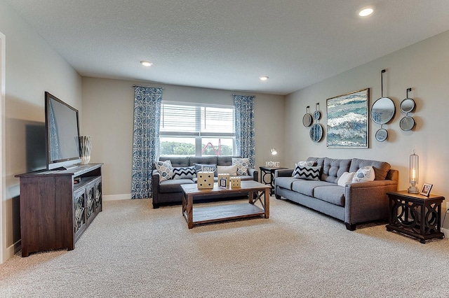 carpeted living room with a textured ceiling