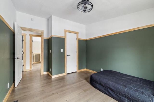 bedroom featuring wood-type flooring