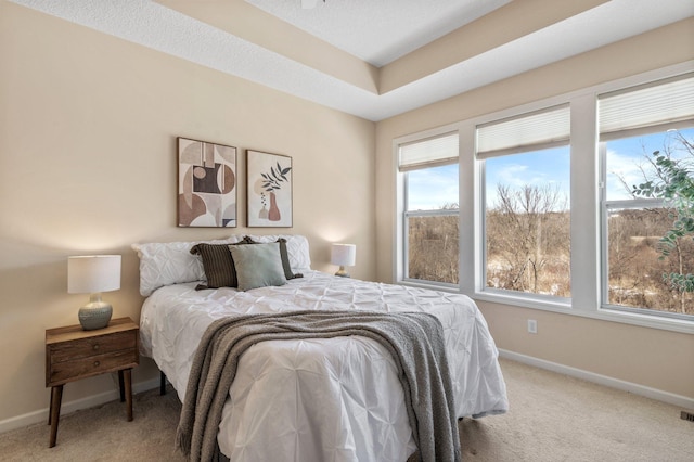 bedroom with light colored carpet